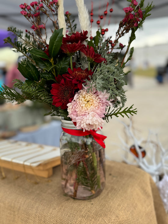 Holiday farm fresh flower and greens arrangement
