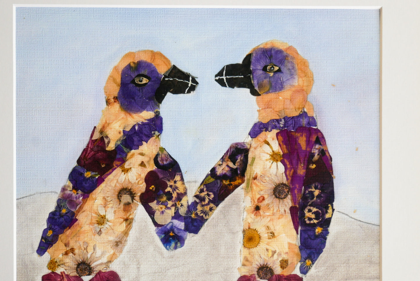 two colorful birds with vibrant feathers, standing close together and facing each other.
