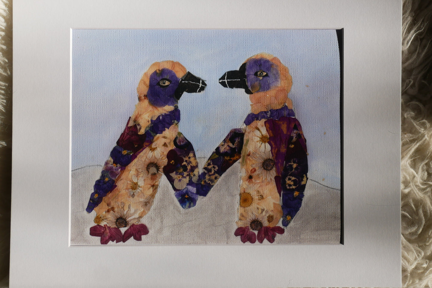 The image is a painting of two colorful birds, possibly penguins, standing together and holding hands.