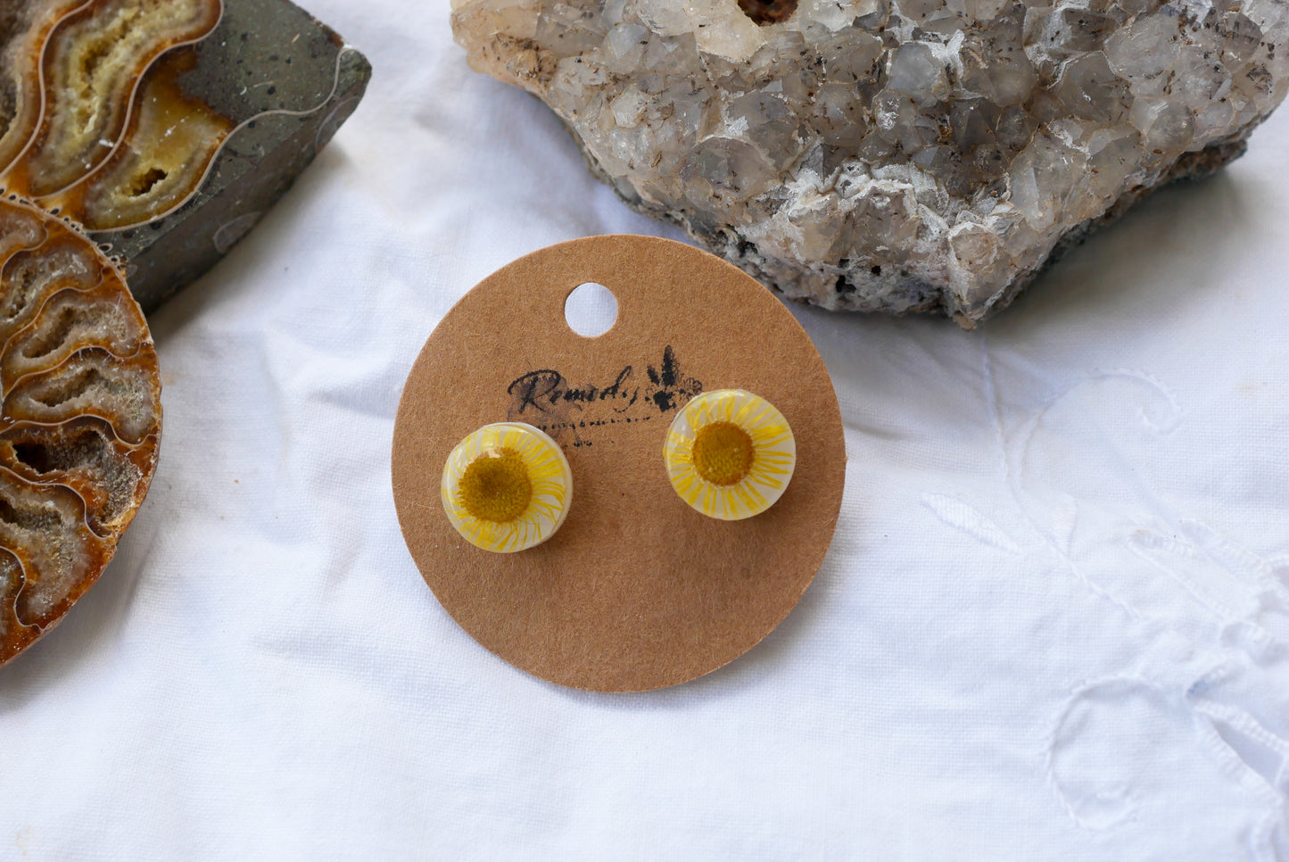Pressed yellow daisy studs