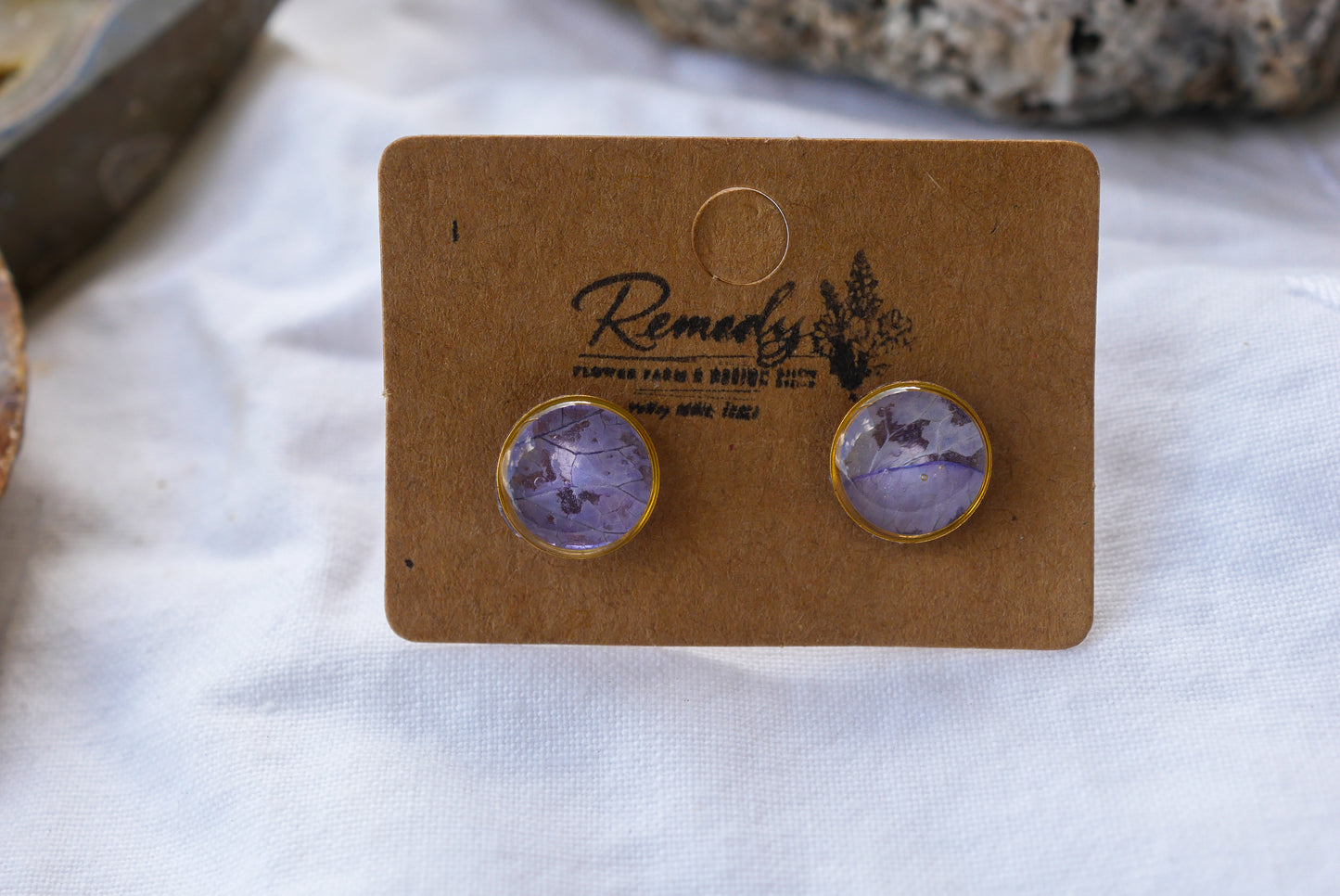Tiny pressed purple rose petal stud earrings
