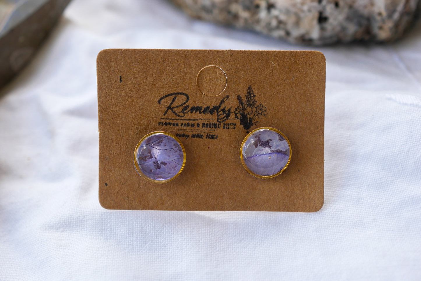 Tiny pressed purple rose petal stud earrings