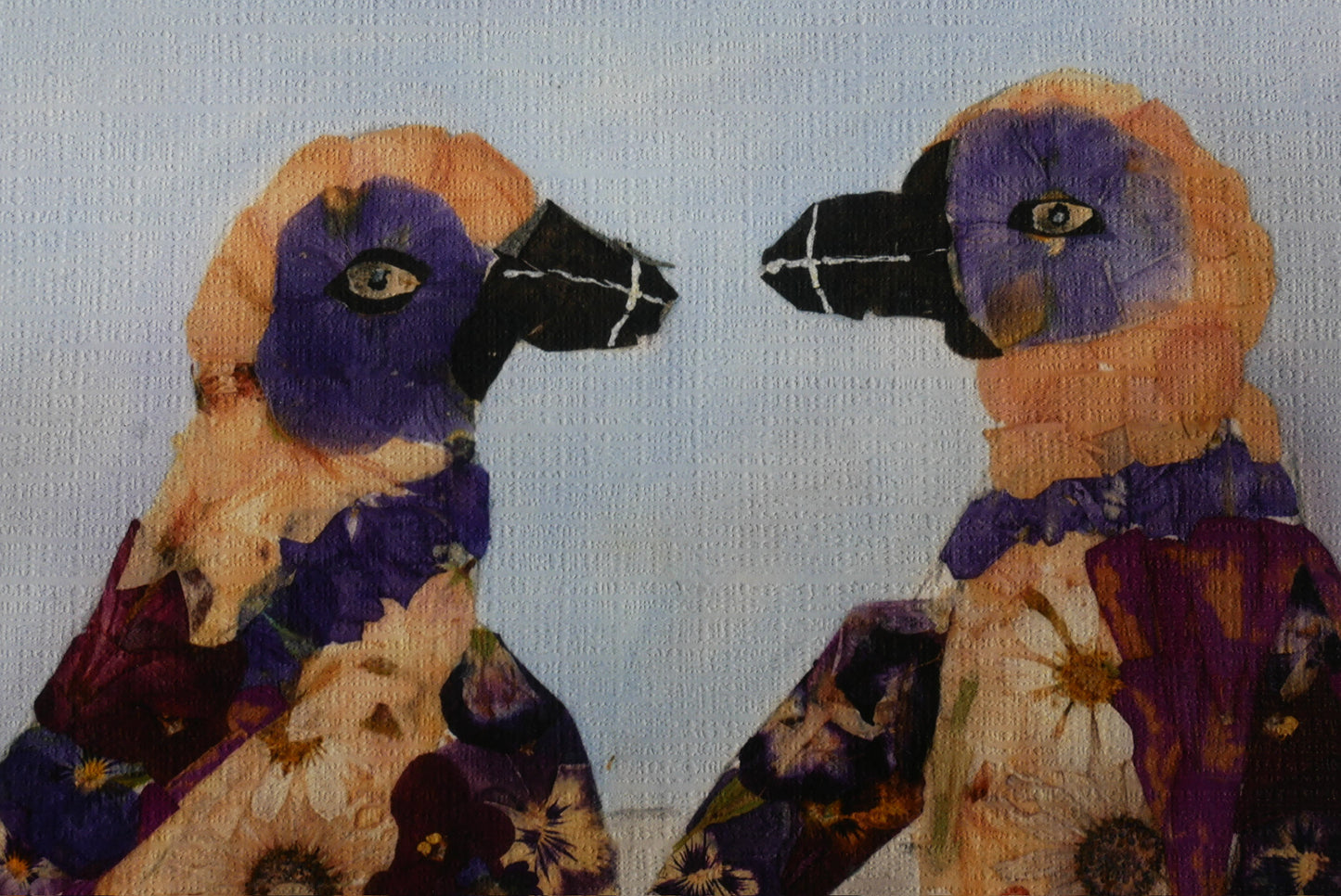 two colorful birds with vibrant feathers, one wearing a purple and orange patterned outfit and the other wearing a purple and orange patterned outfit.