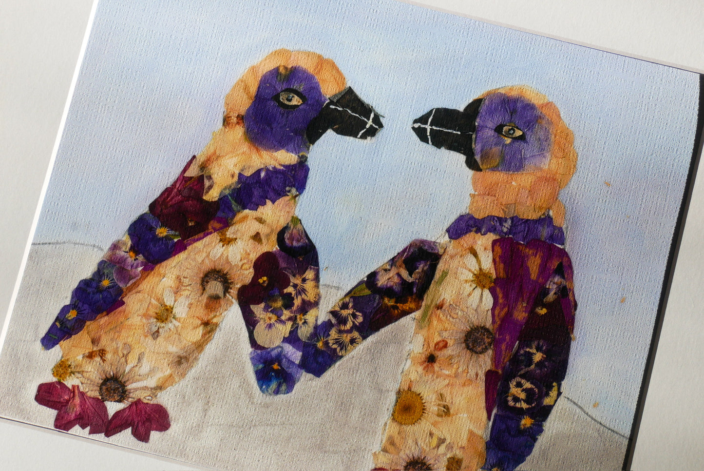 The image is a painting featuring two colorful birds with flower-like patterns on their bodies, set against a blue background.