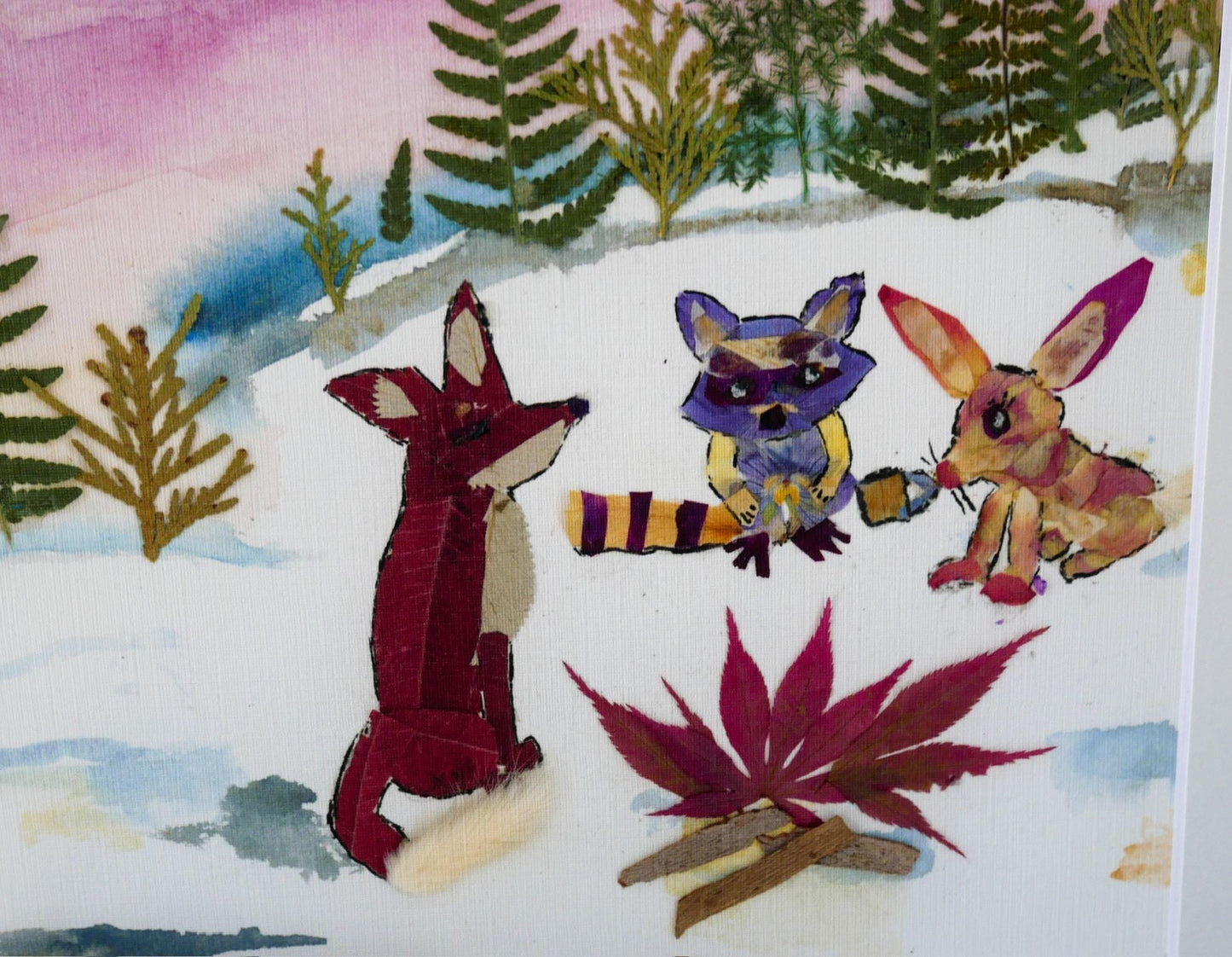 The image is a collage featuring three cartoon animal characters, including a fox, a raccoon, and a rabbit, set against a snowy landscape with trees and a campfire.