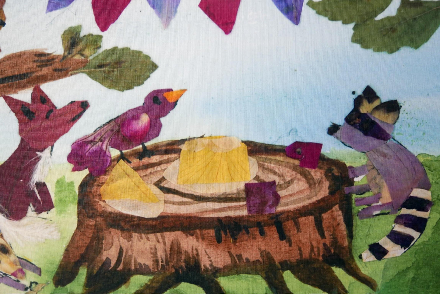 The image is a colorful painting depicting a bird, a fox, and a raccoon gathered around a tree stump with food items on it.