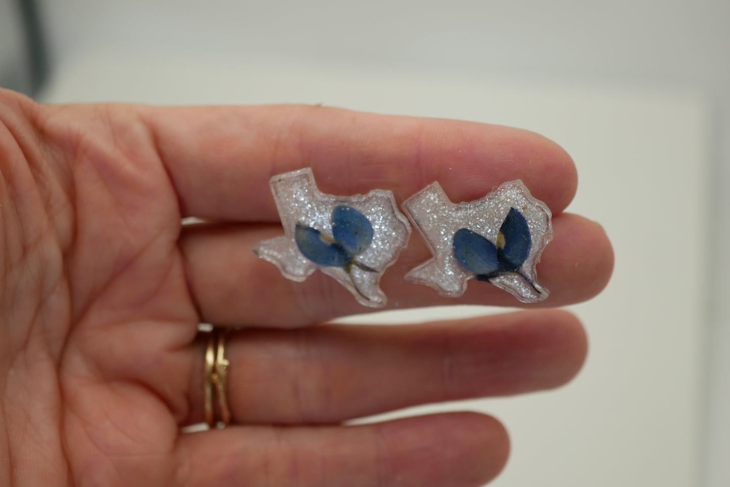 texas bluebonnets encased in texas shape stud earrings